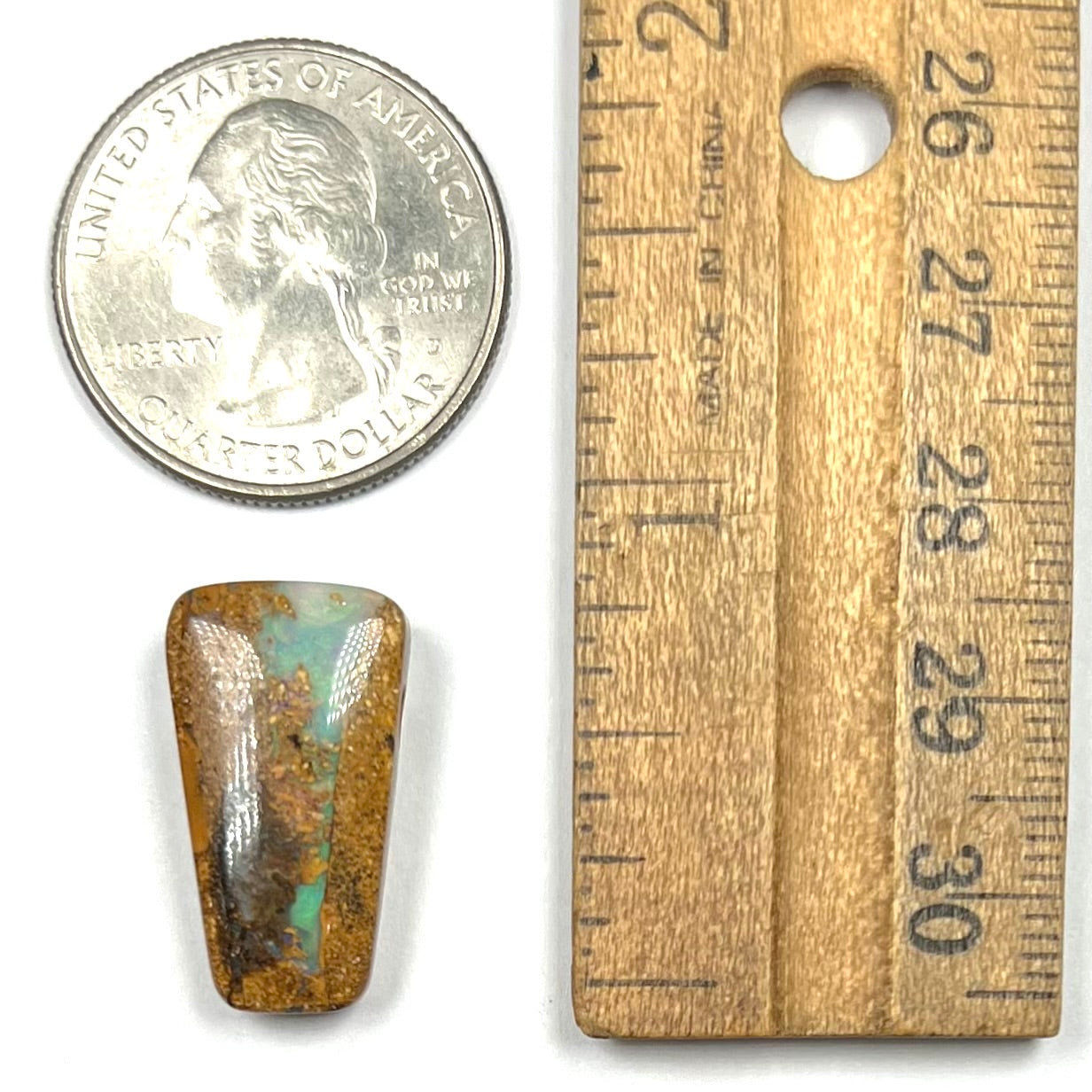 A polished, drilled pipe boulder opal bead.