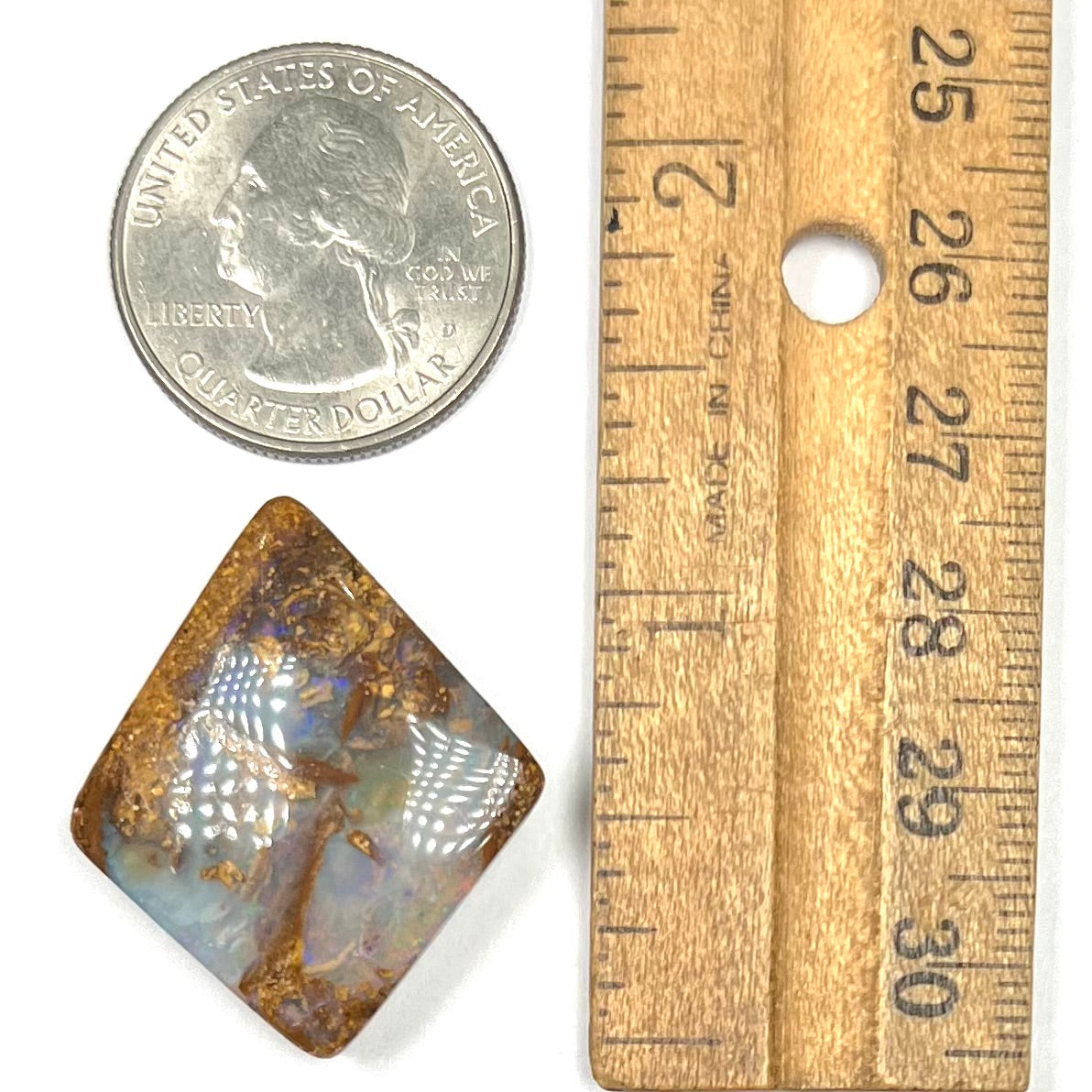 A polished, drilled pipe boulder opal bead.