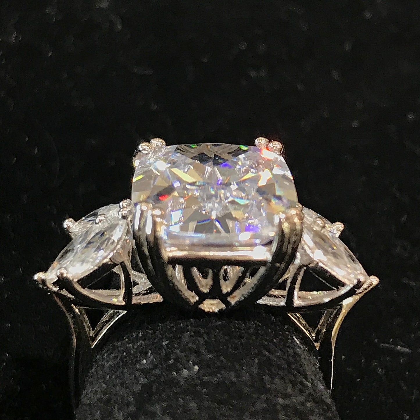 Winged white cubic zirconia ring set in sterling silver.