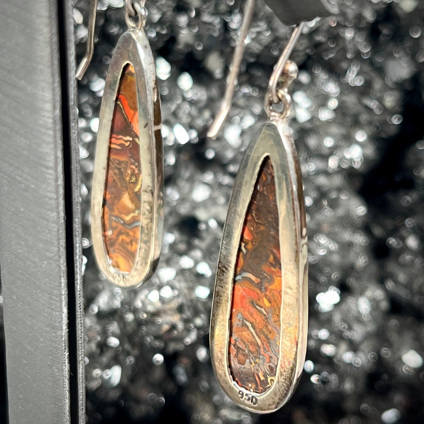 A pair of sterling silver boulder opal drop dangle earrings.