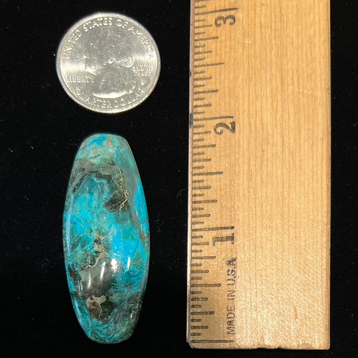 A barrel cabochon cut turquoise from Kingman, Arizona.