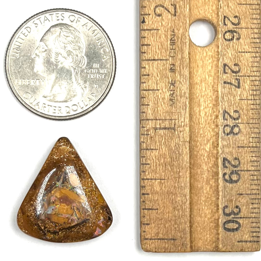 A polished, drilled pipe boulder opal bead.