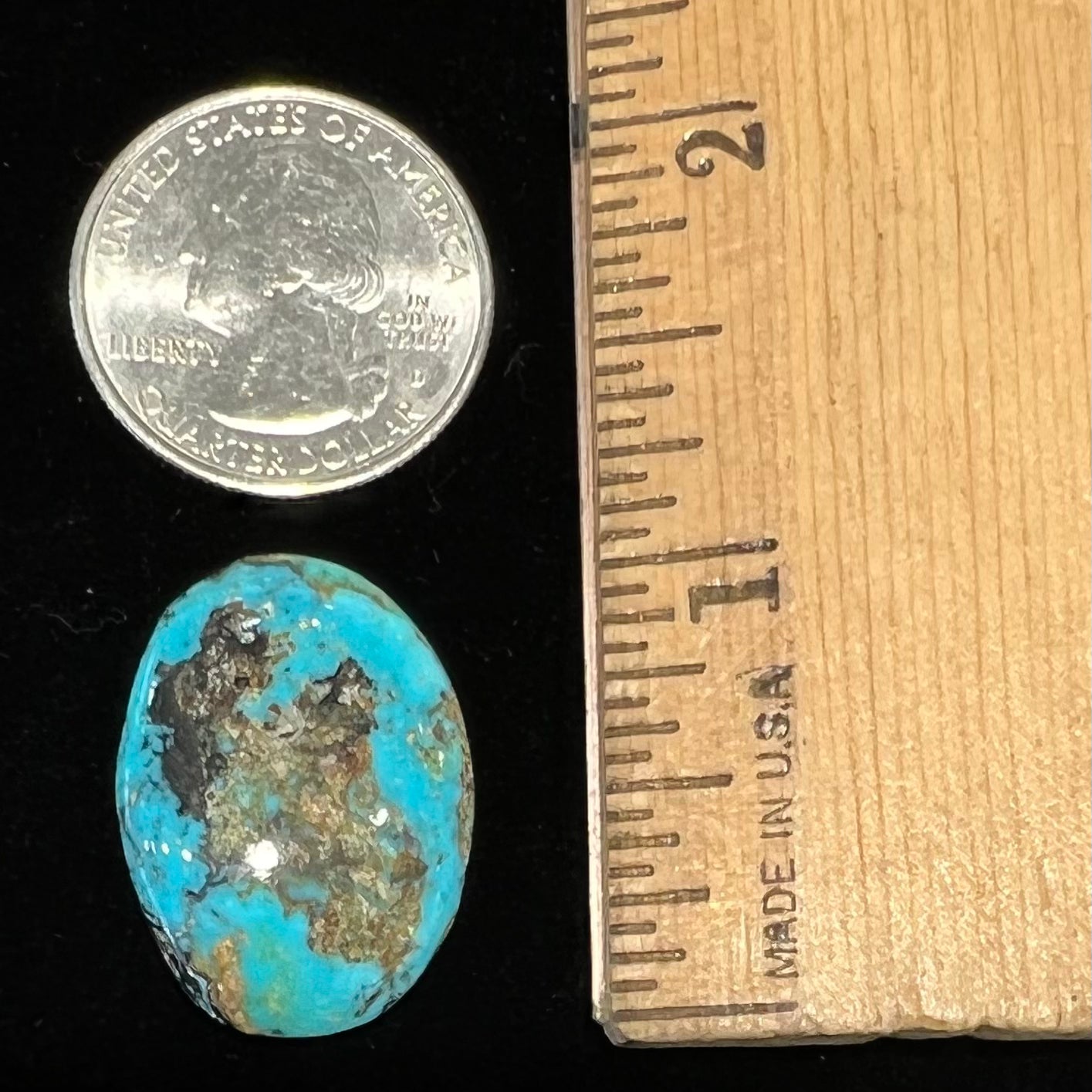 An oval cabochon cut Valley Blue turquoise stone.