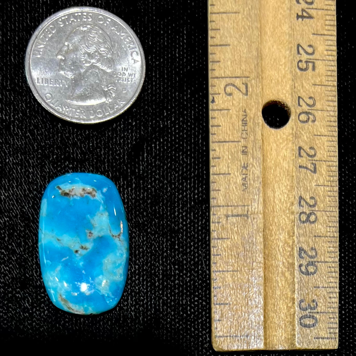 A blue barrel cabochon cut turquoise stone from the Sleeping Beauty Mine.