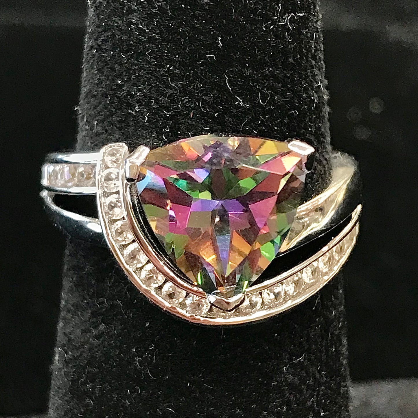 Mystic topaz ring with cubic zirconia side stones set in sterling silver with a double band design.
