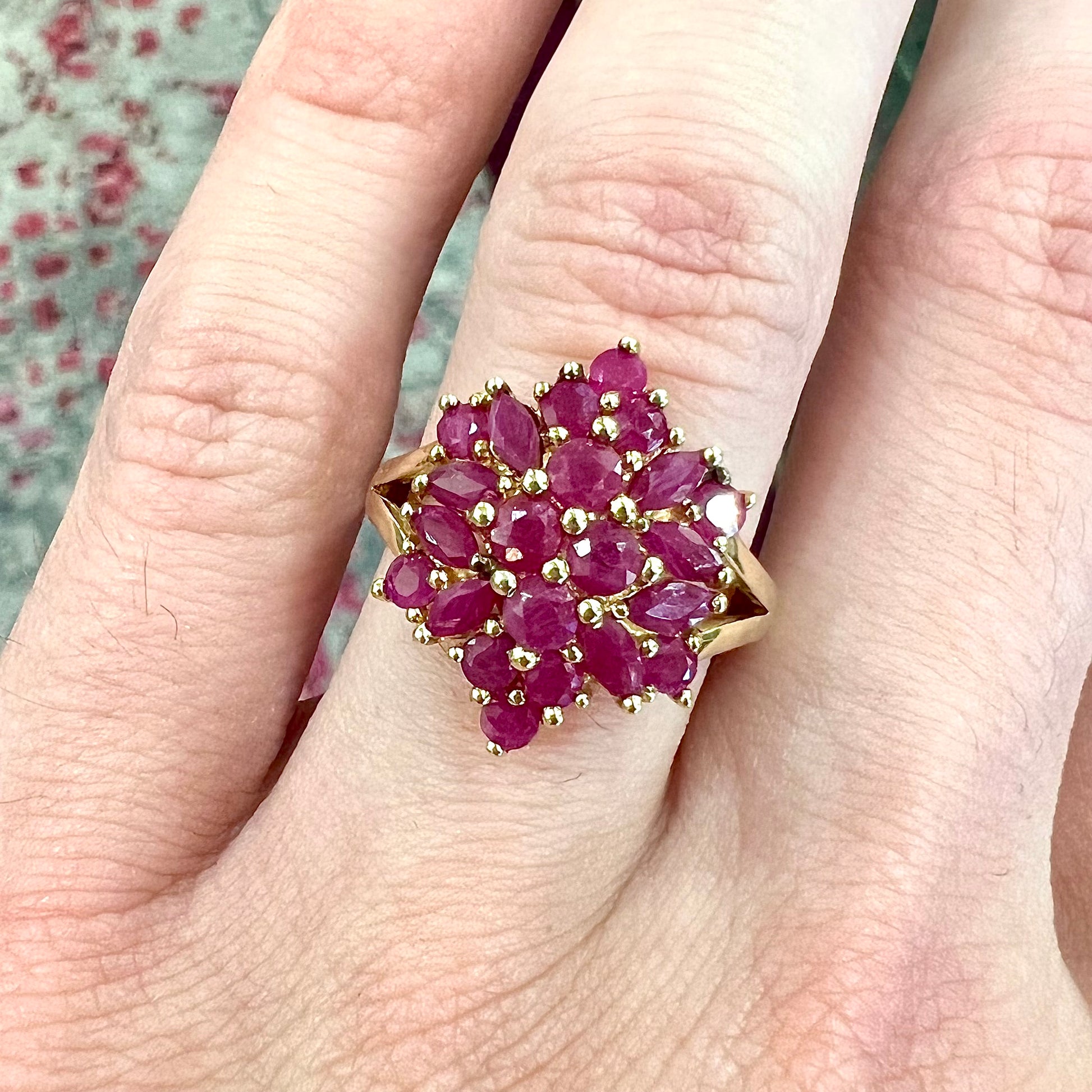 Burma ruby cluster ring set in 14 karat yellow gold.