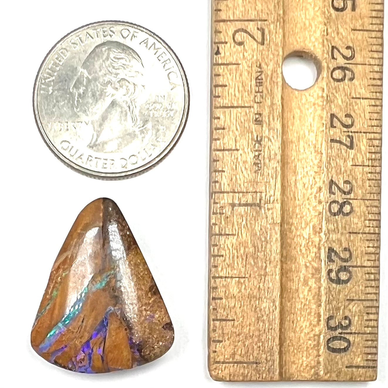A polished, drilled pipe boulder opal bead.