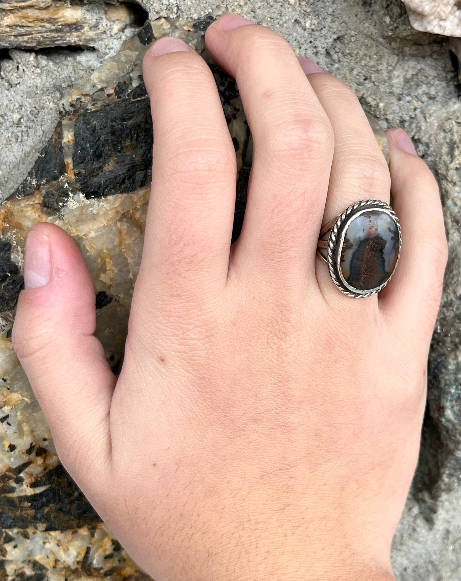 Plume Agate ring set in sterling silver with a twisted rope bezel design.