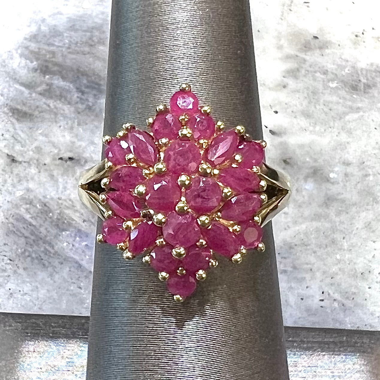 Burma ruby cluster ring set in 14 karat yellow gold.