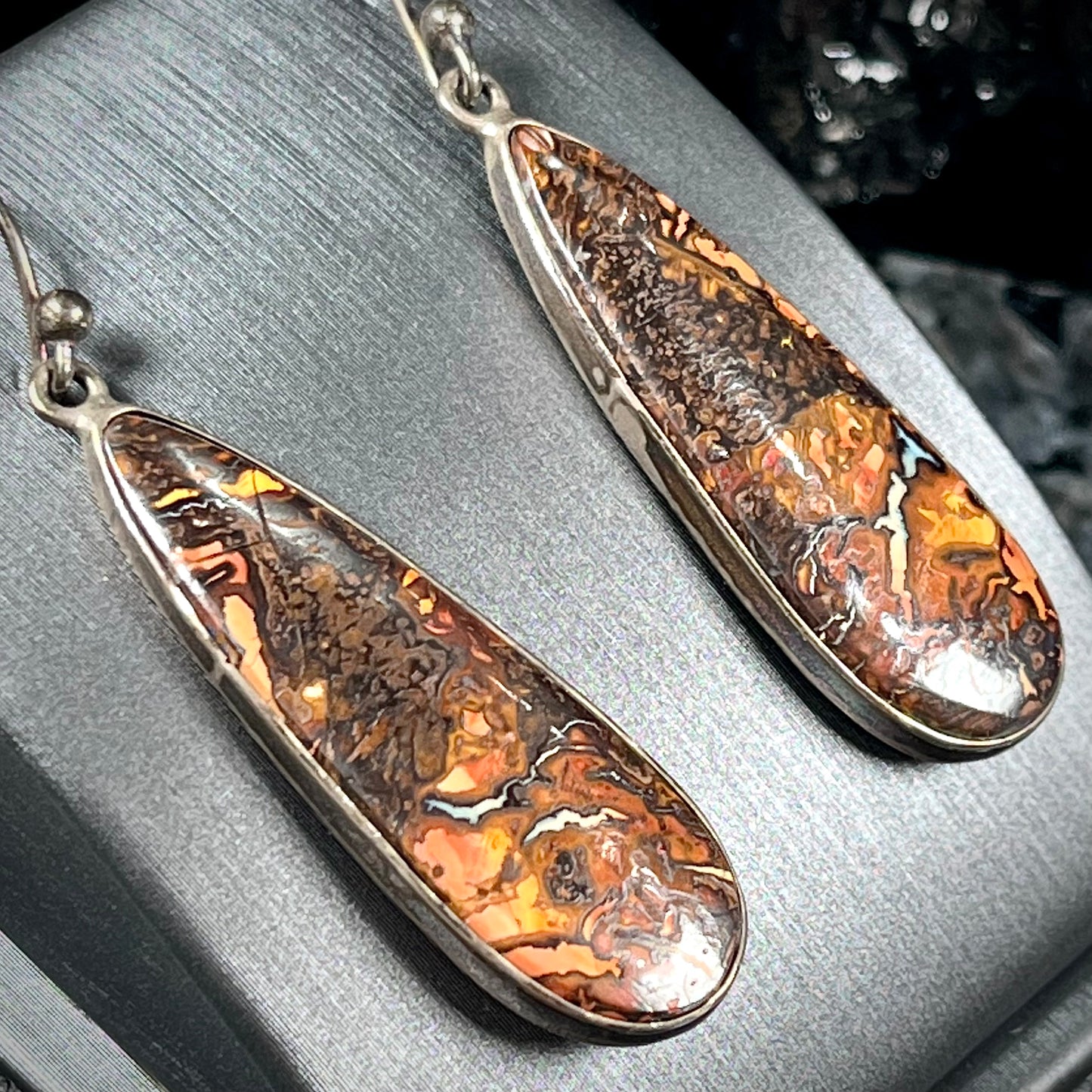 A pair of sterling silver boulder opal drop dangle earrings.