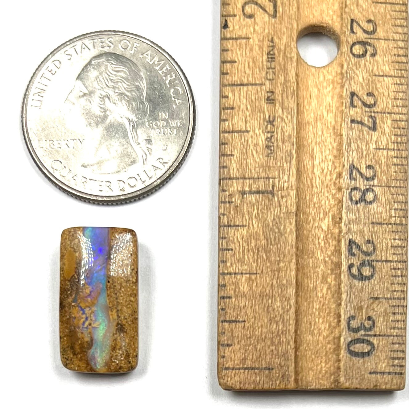 A polished, drilled pipe boulder opal bead.