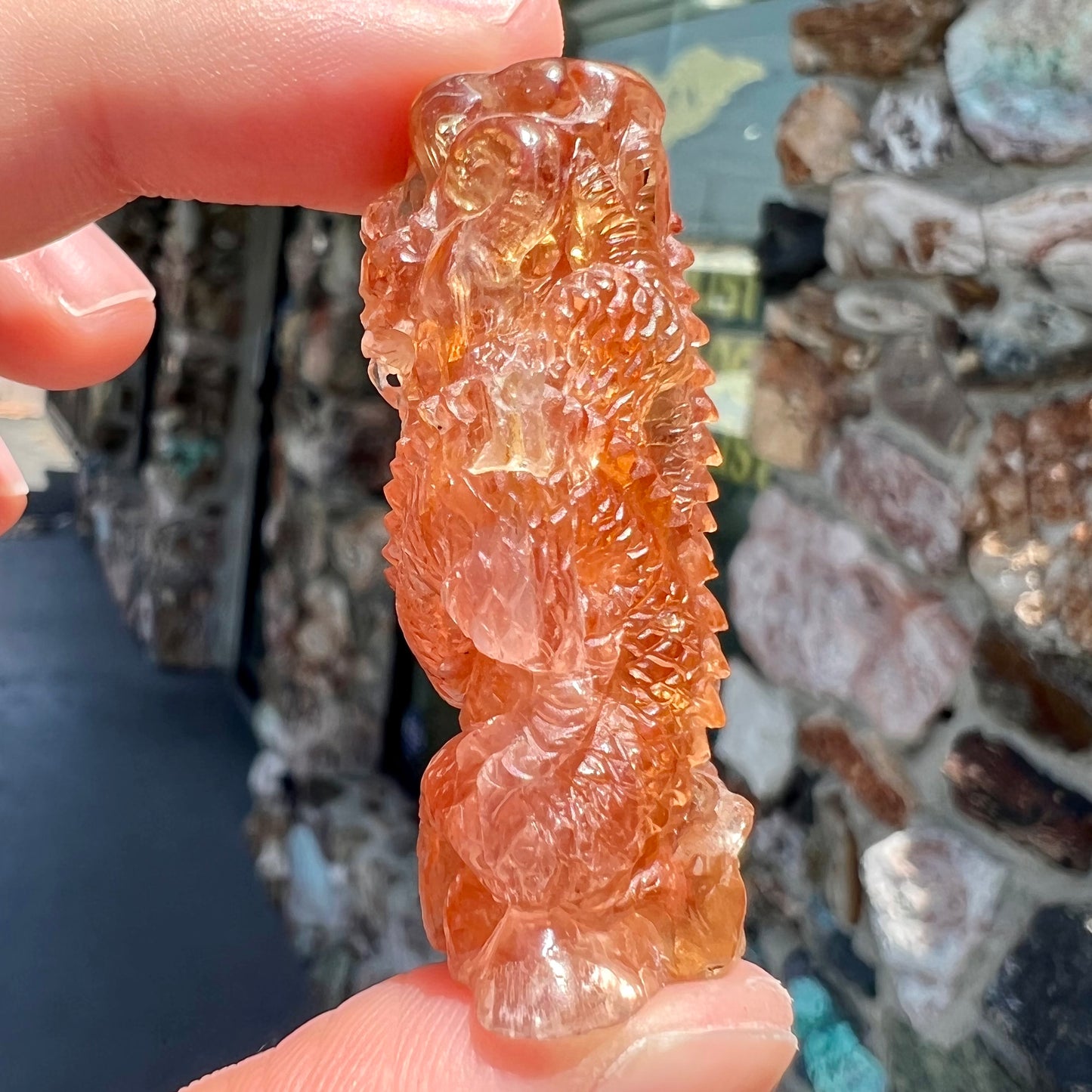 A dragon carved by Ronald Stevens from imperial topaz crystal.