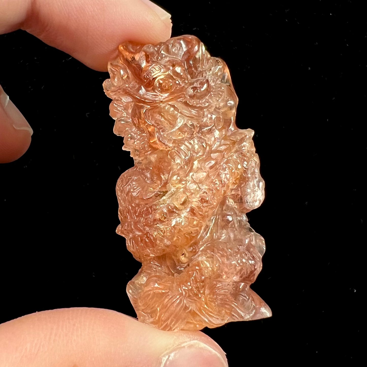 A dragon carved by Ronald Stevens from imperial topaz crystal.
