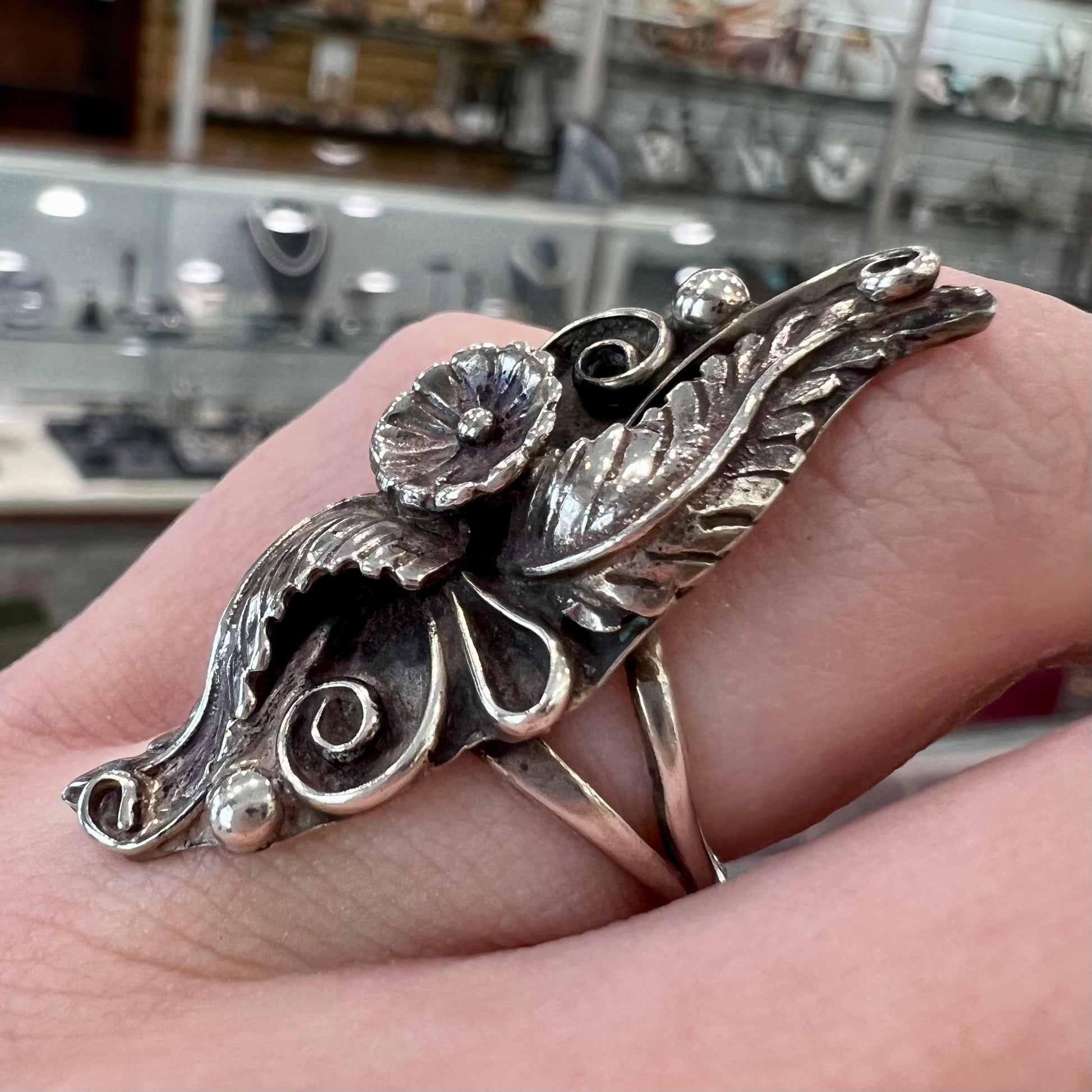 A sterling silver Navajo flower ring.
