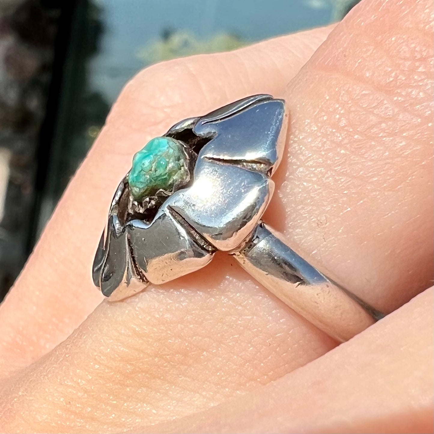 A handmade, sterling silver Native American turquoise nugget ring.