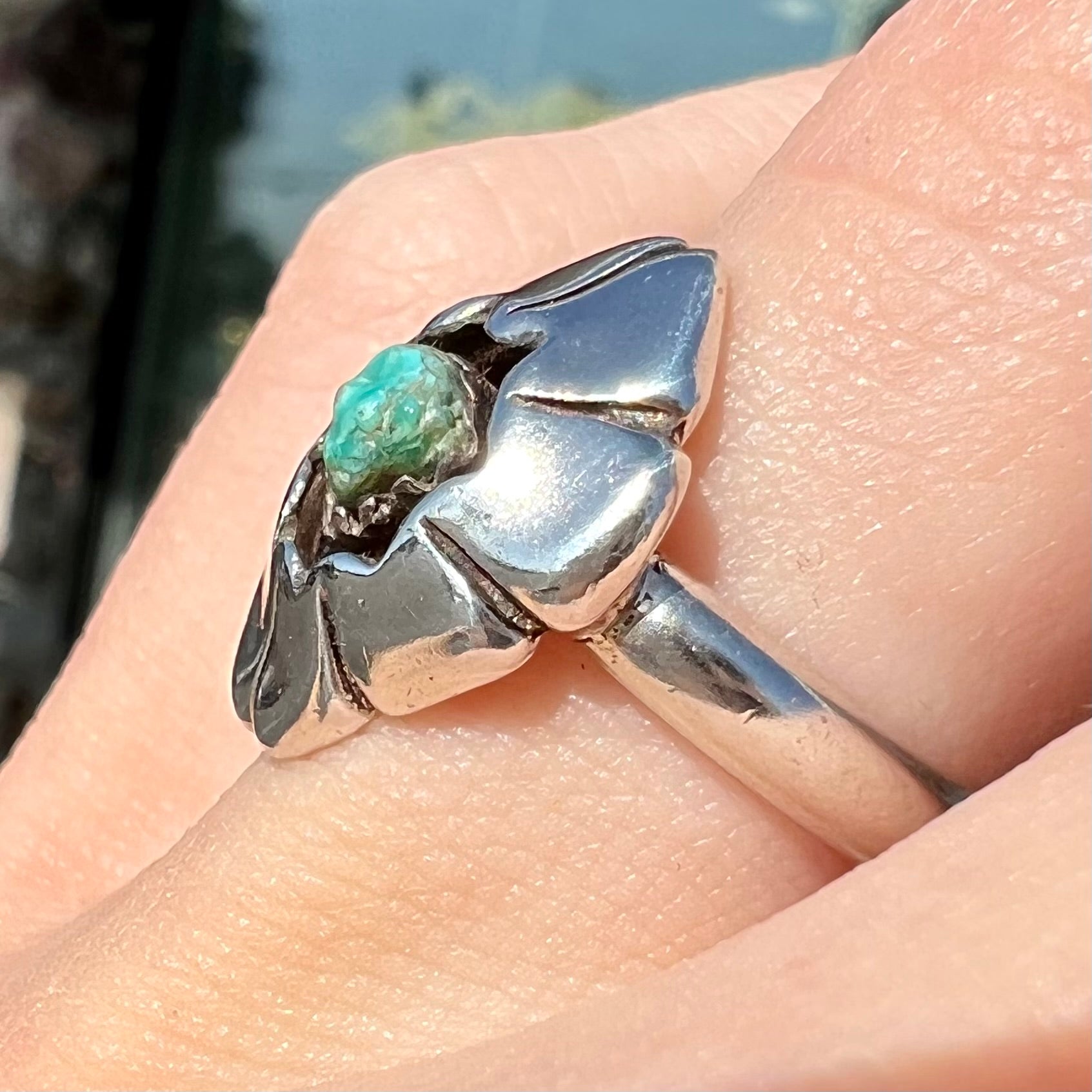 A handmade, sterling silver Native American turquoise nugget ring.