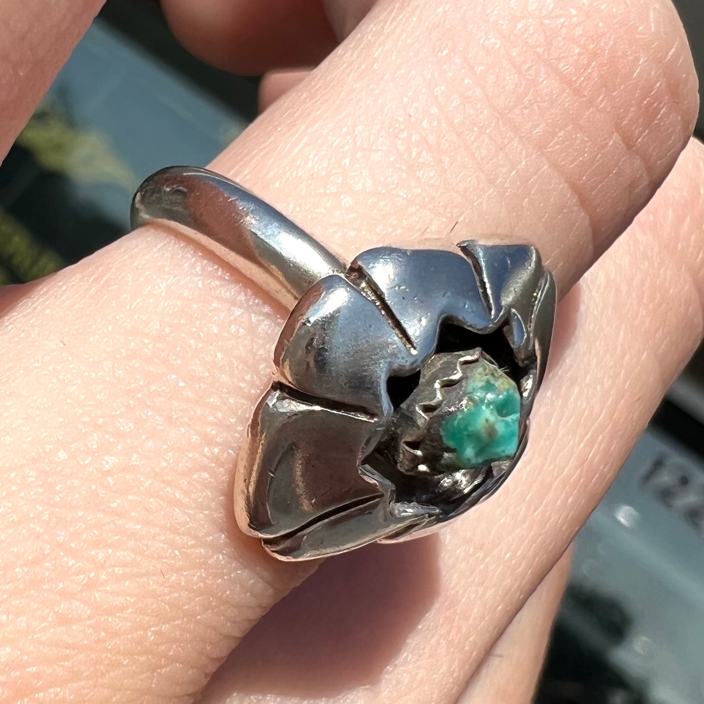 A handmade, sterling silver Native American turquoise nugget ring.