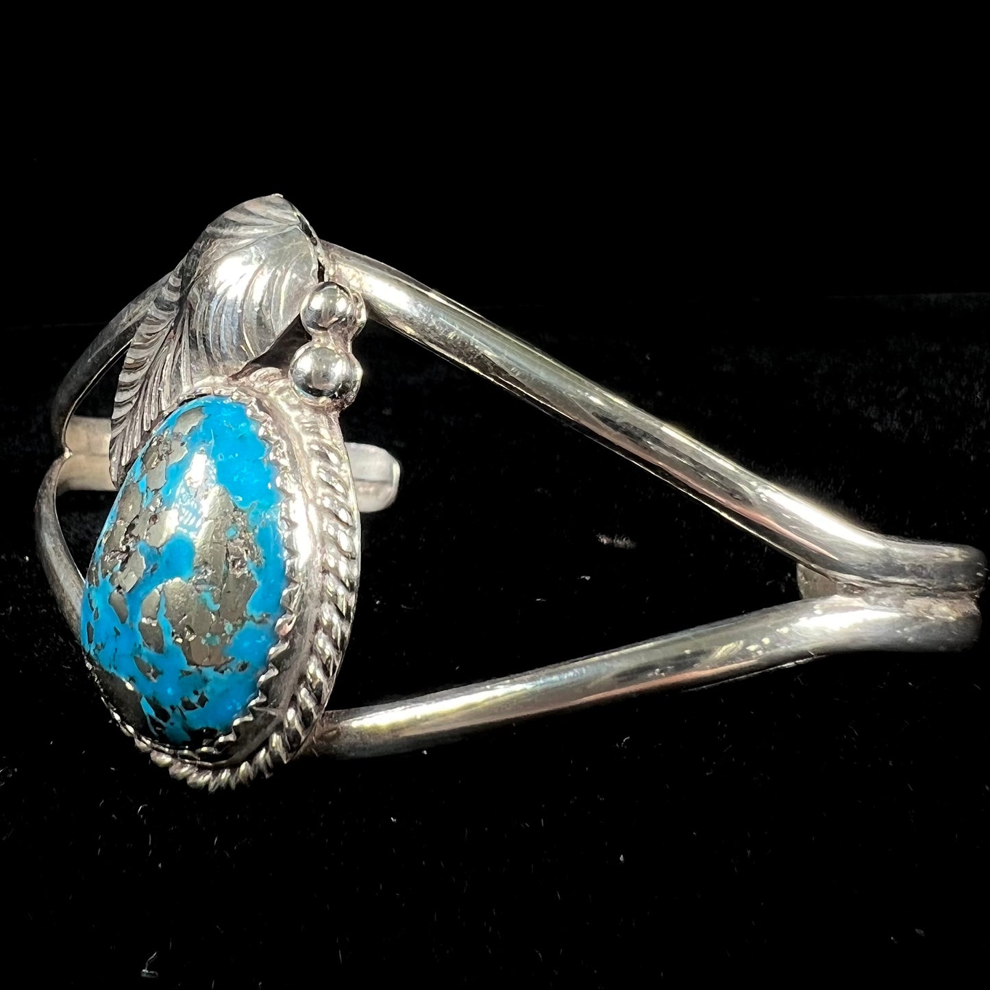 A ladies' silver Navajo cuff bracelet set with a piece of Morenci turquoise stone.