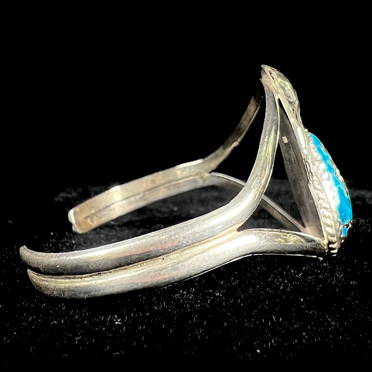 A ladies' silver Navajo cuff bracelet set with a piece of Morenci turquoise stone.