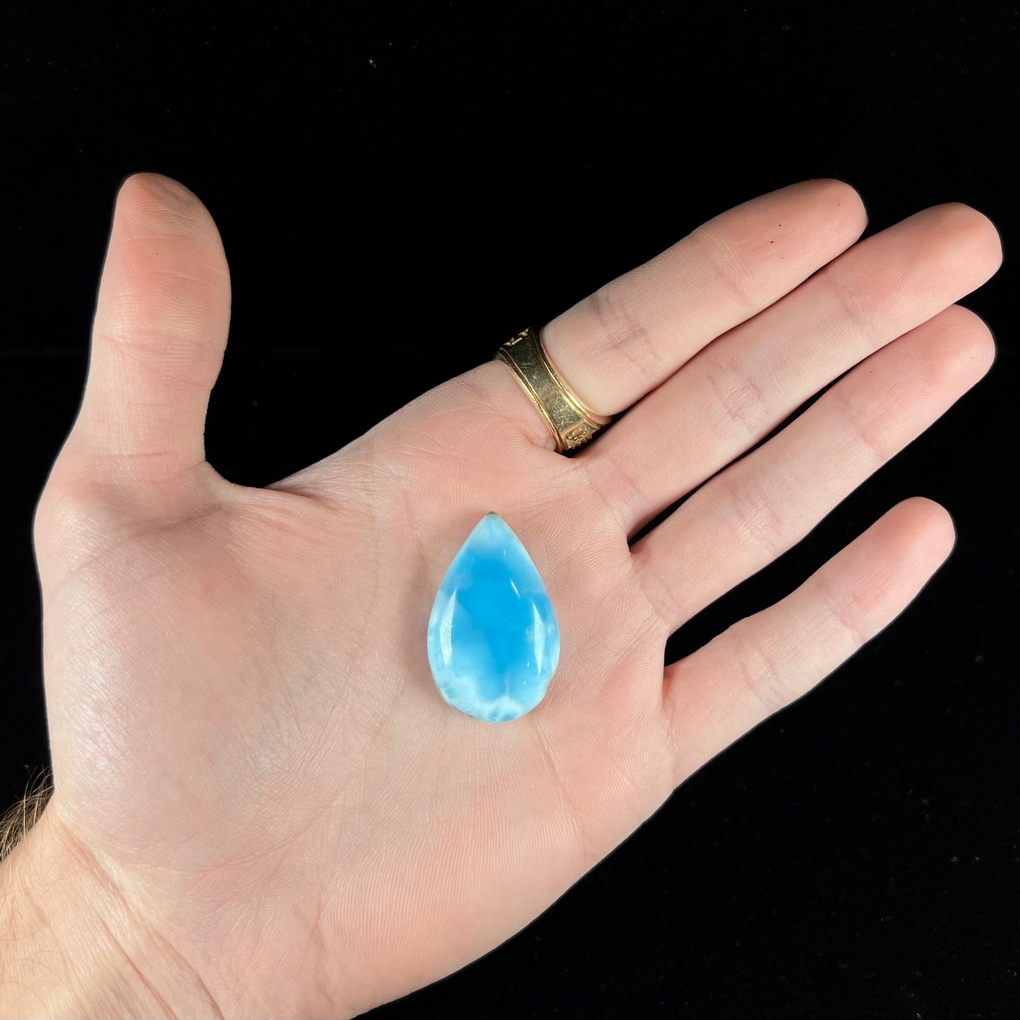 A loose, pear shaped larimar cabochon from Dominican Republic. The stone is AAA+ grade.