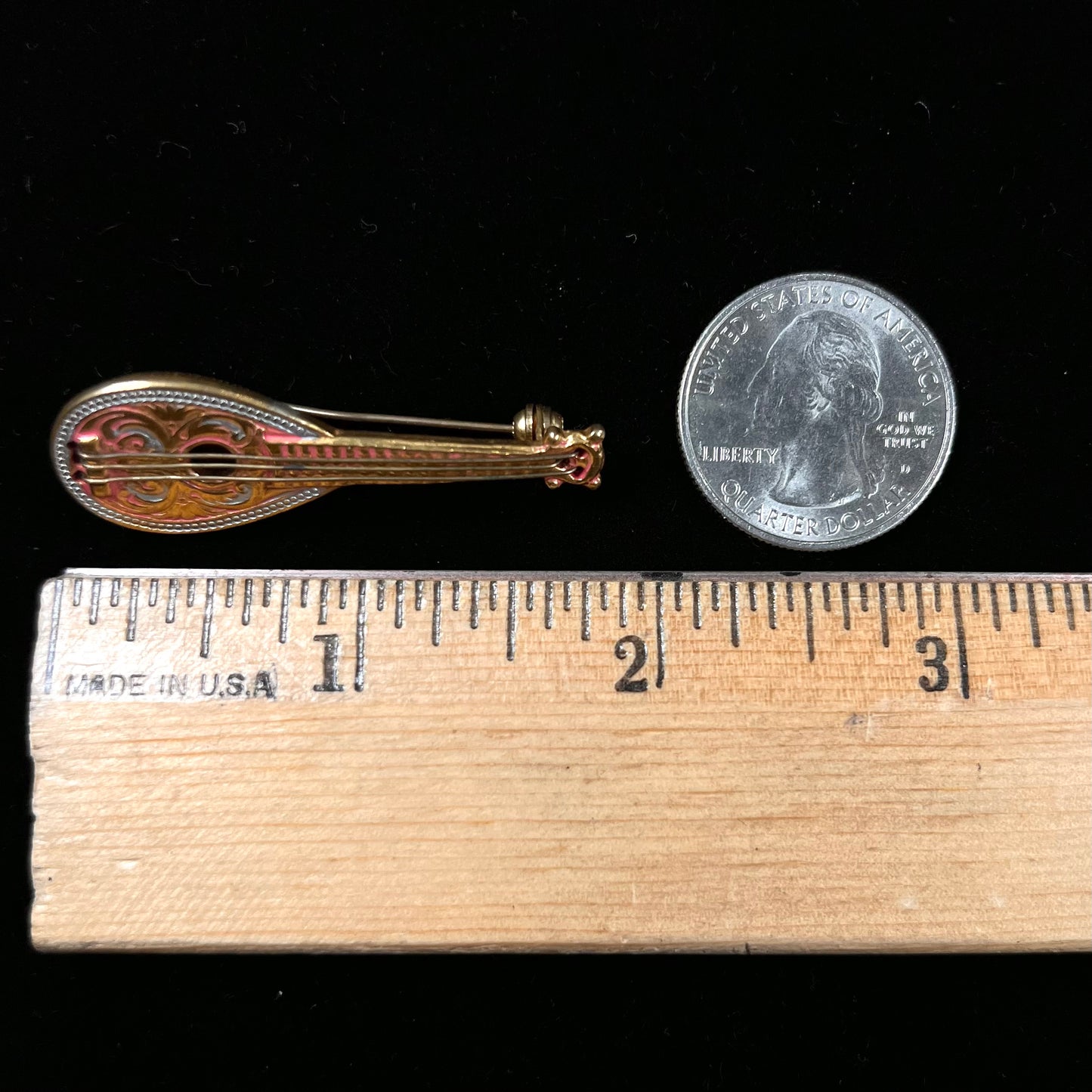 A gold filled mandolin brooch. The back of the pin is stamped "SPAIN."