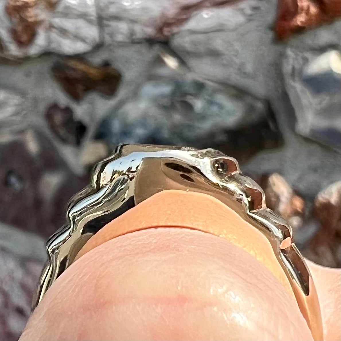 Men's fire agate solitaire ring cast in yellow gold. The ring is a step design.