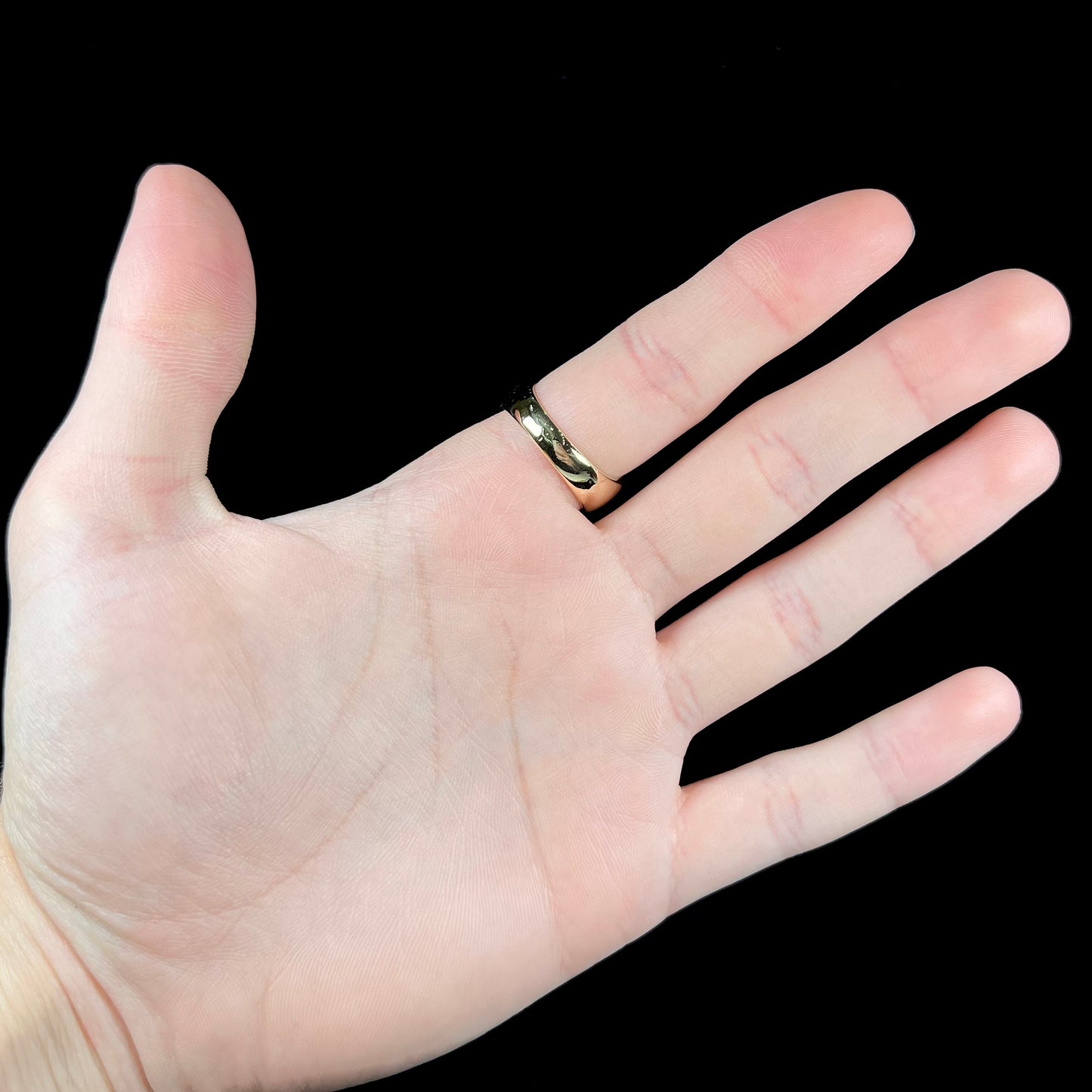 A men's brushed yellow gold fire agate ring with polished accents.