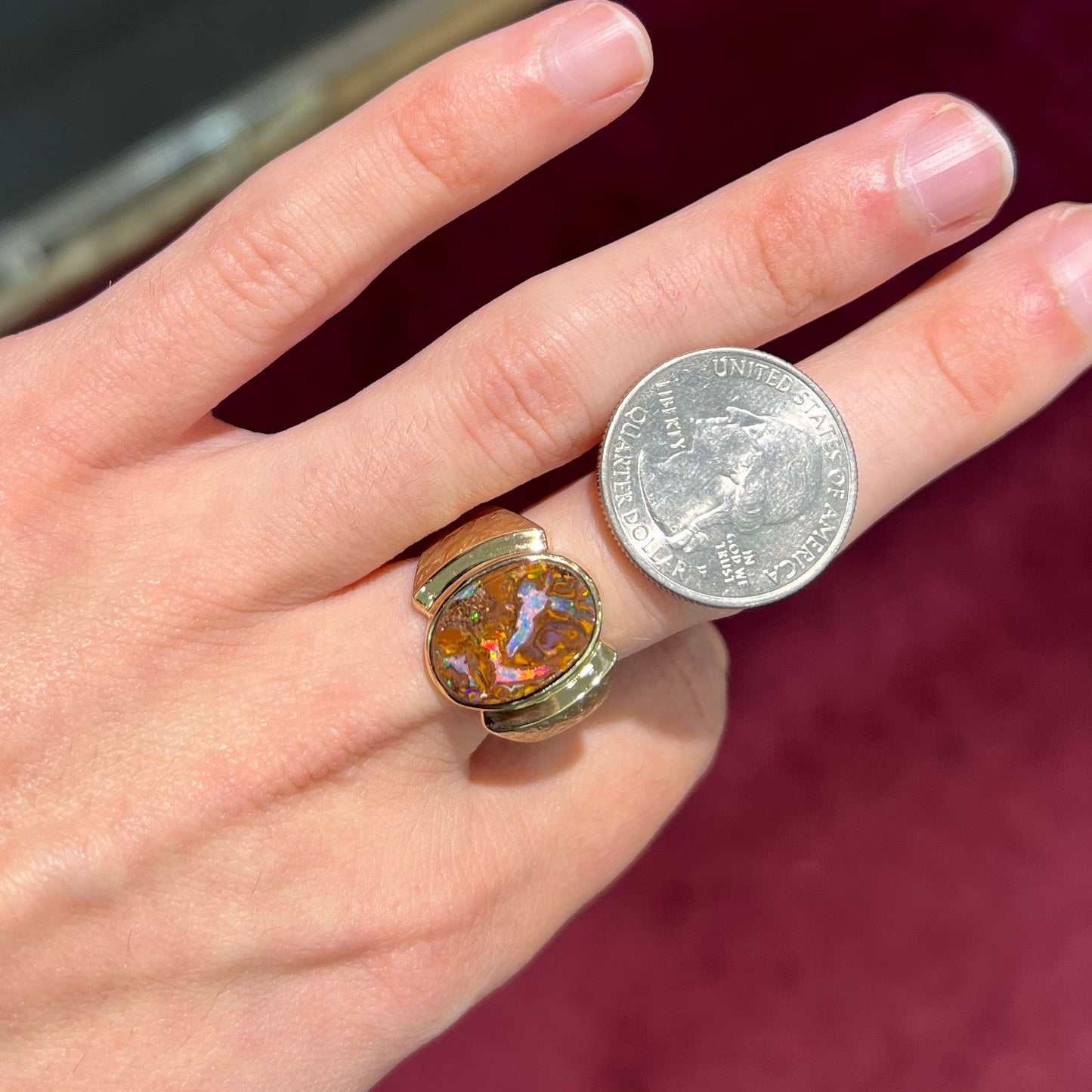 A Koroit boulder opal men's ring in brushed yellow gold.