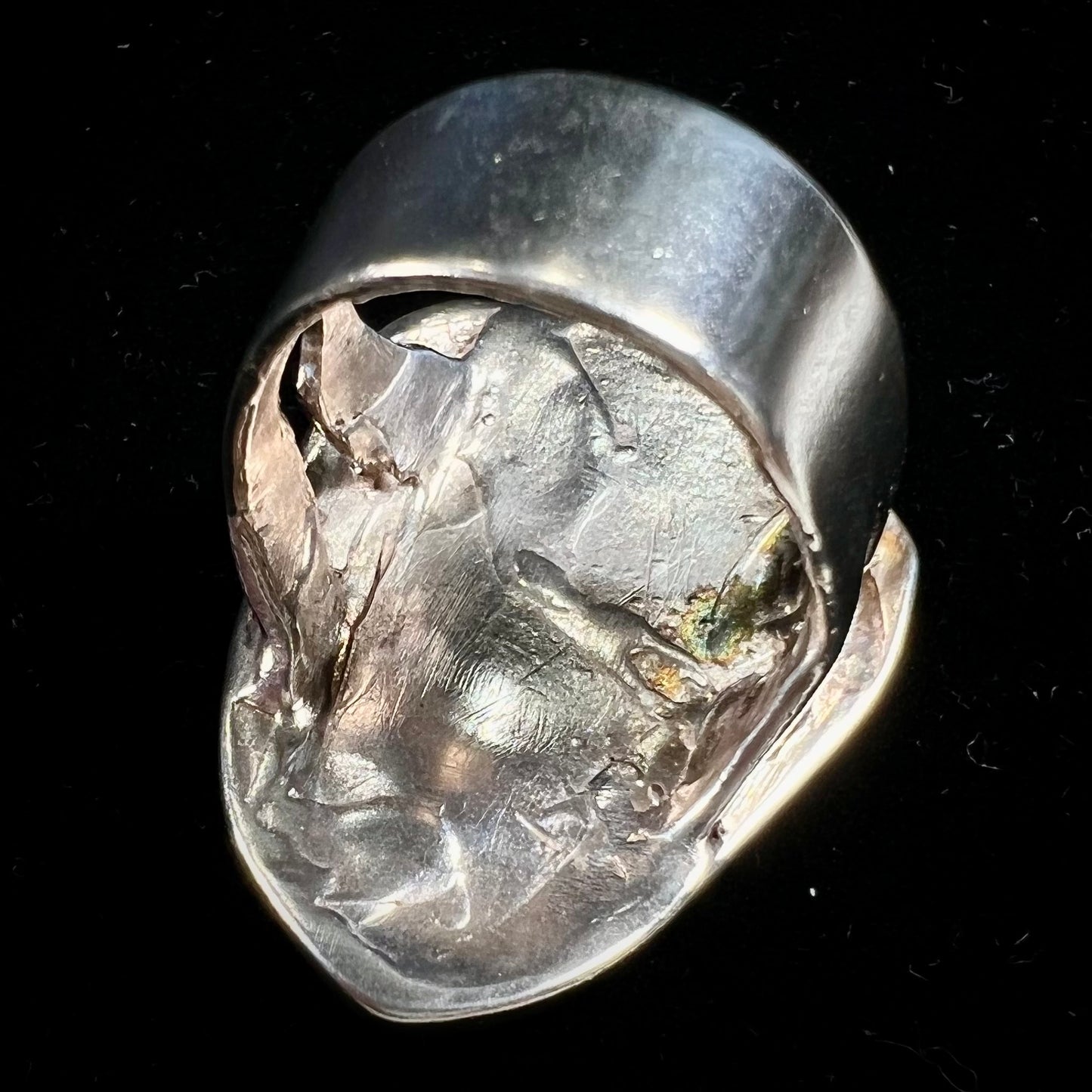 A men's sterling silver ring set with a powder blue turquoise stone. The ring is rustic style.