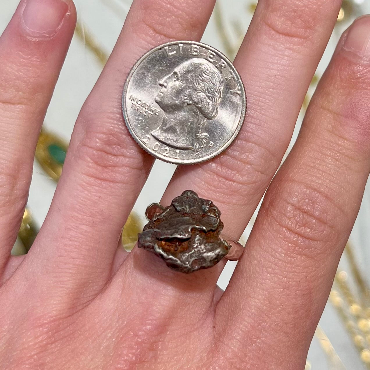 A sterling silver ring set with a Campo del Cielo meteorite.