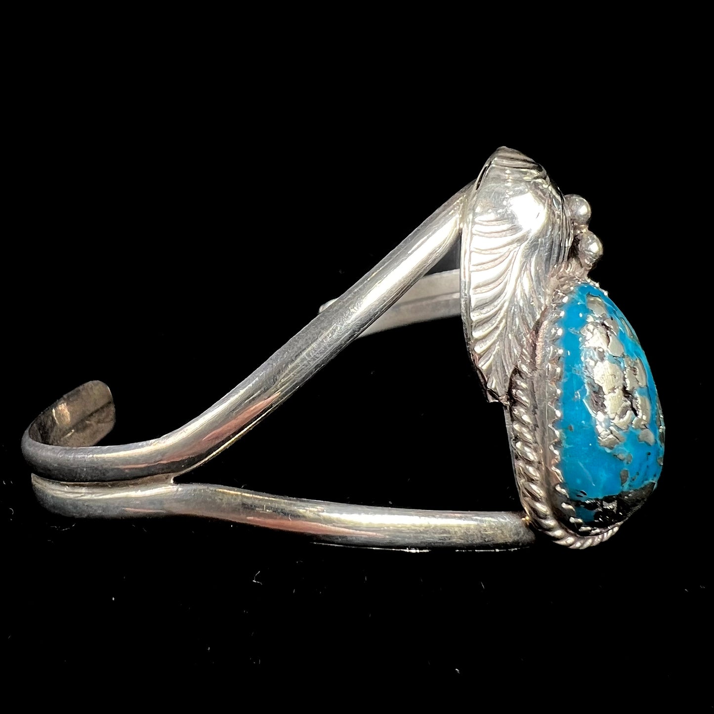A ladies' silver Navajo cuff bracelet set with a piece of Morenci turquoise stone.