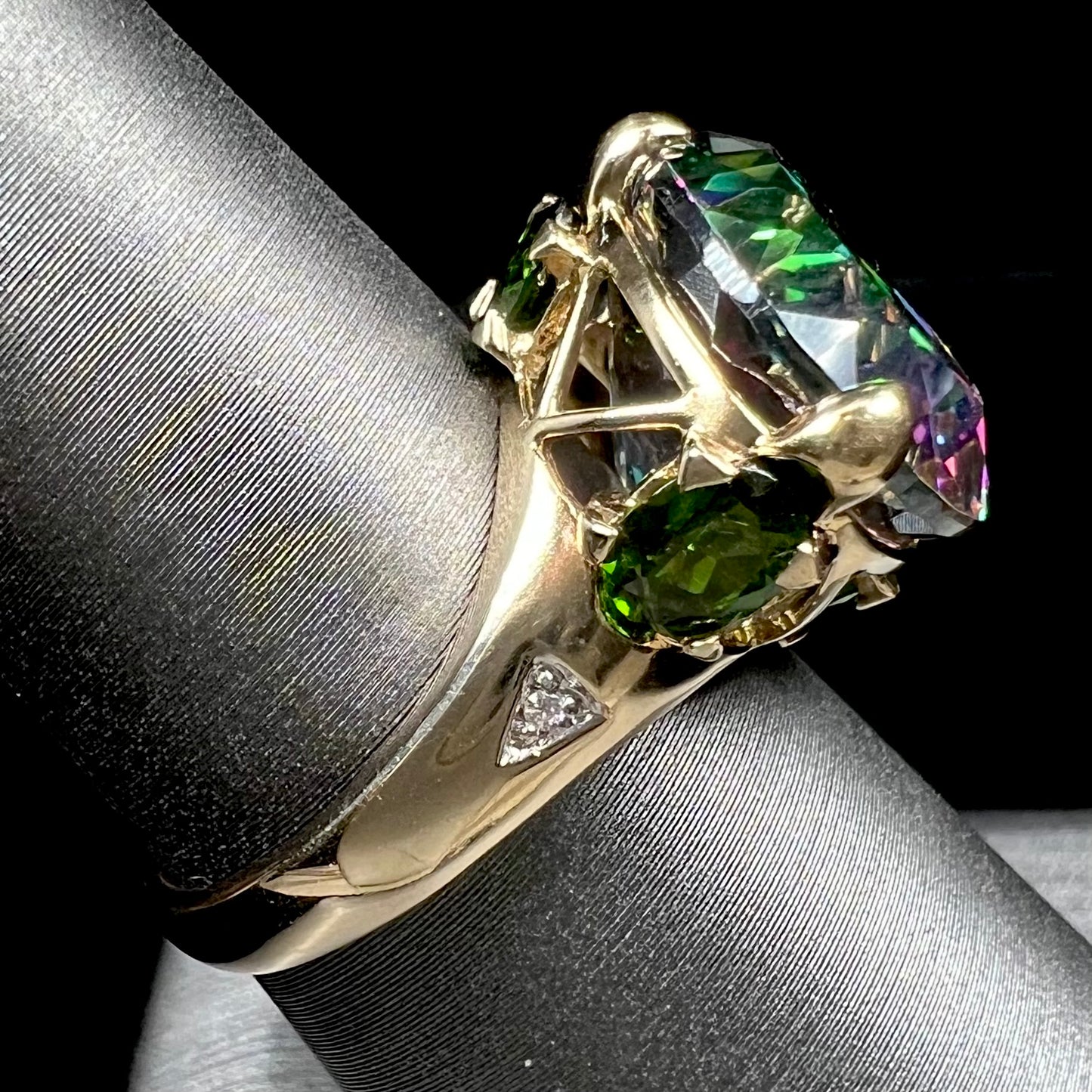 A ladies' large mystic topaz, chrome diopside, and diamond statement ring cast in 14k yellow gold.