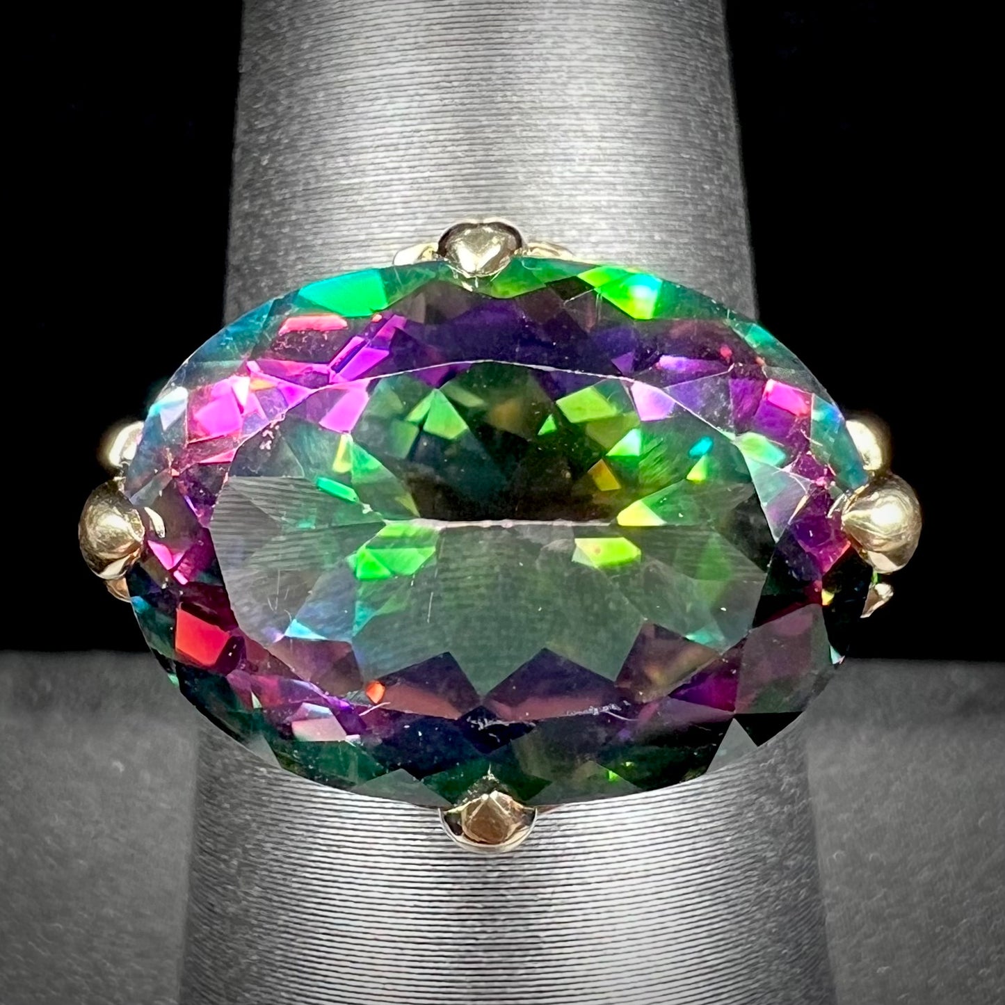 A ladies' large mystic topaz, chrome diopside, and diamond statement ring cast in 14k yellow gold.