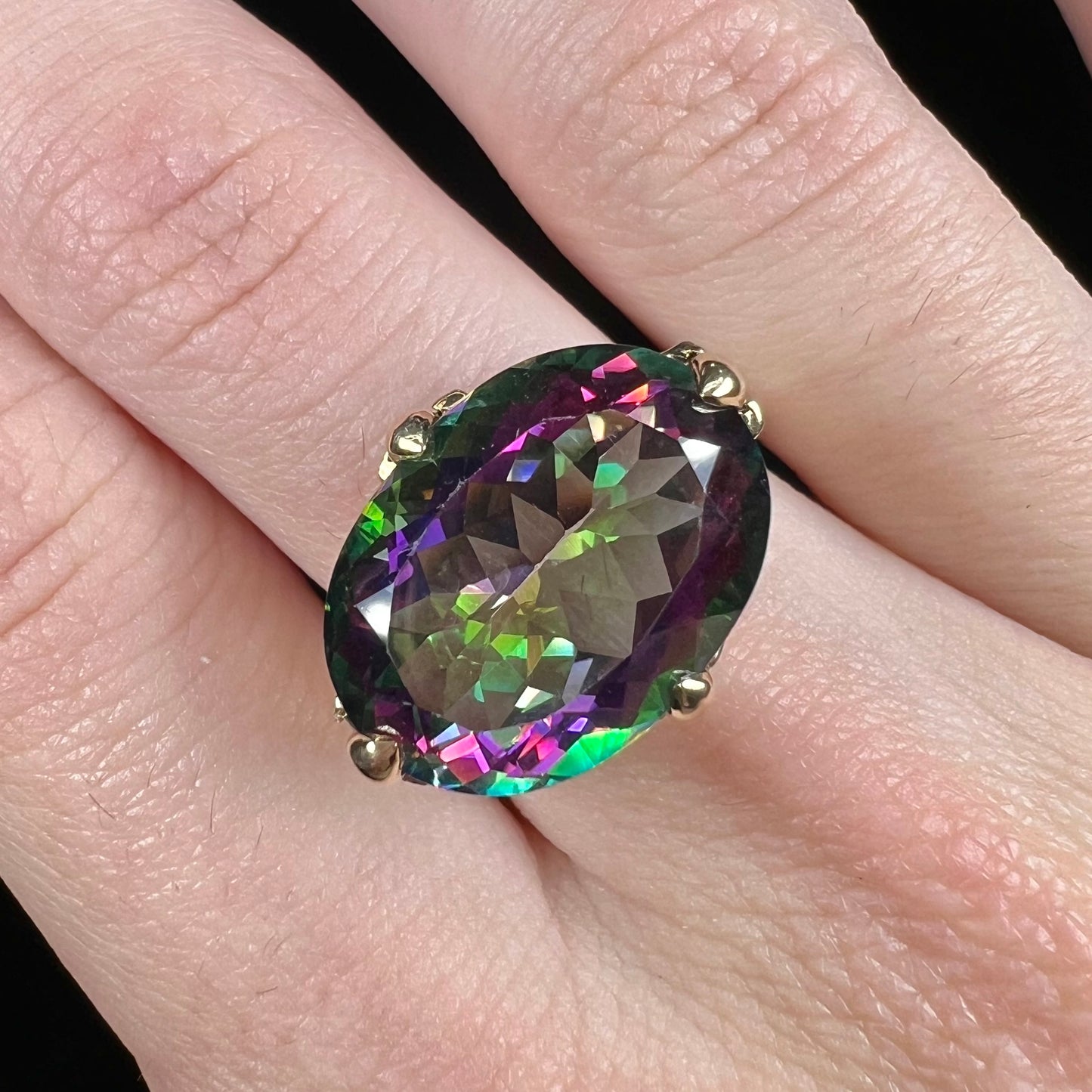 A ladies' large mystic topaz, chrome diopside, and diamond statement ring cast in 14k yellow gold.
