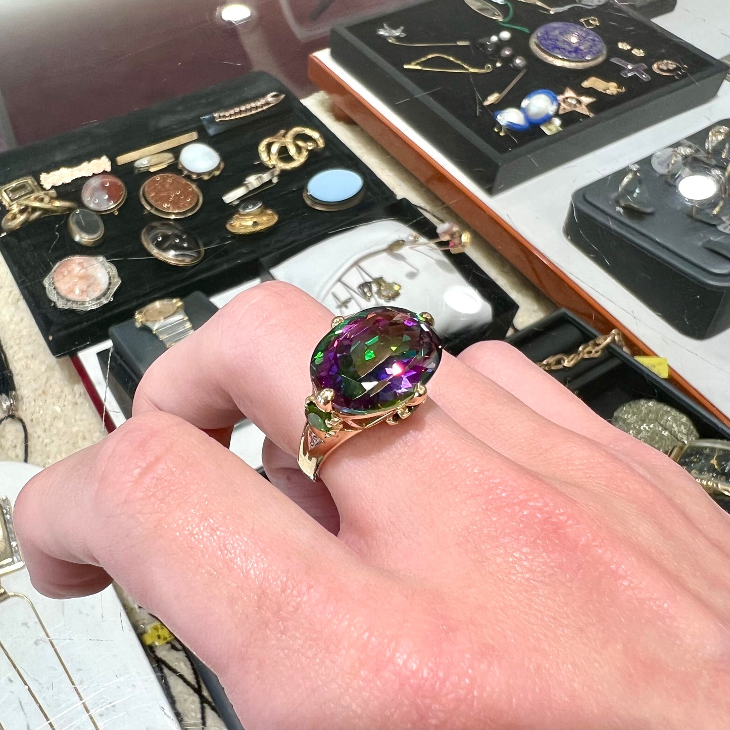 A ladies' large mystic topaz, chrome diopside, and diamond statement ring cast in 14k yellow gold.