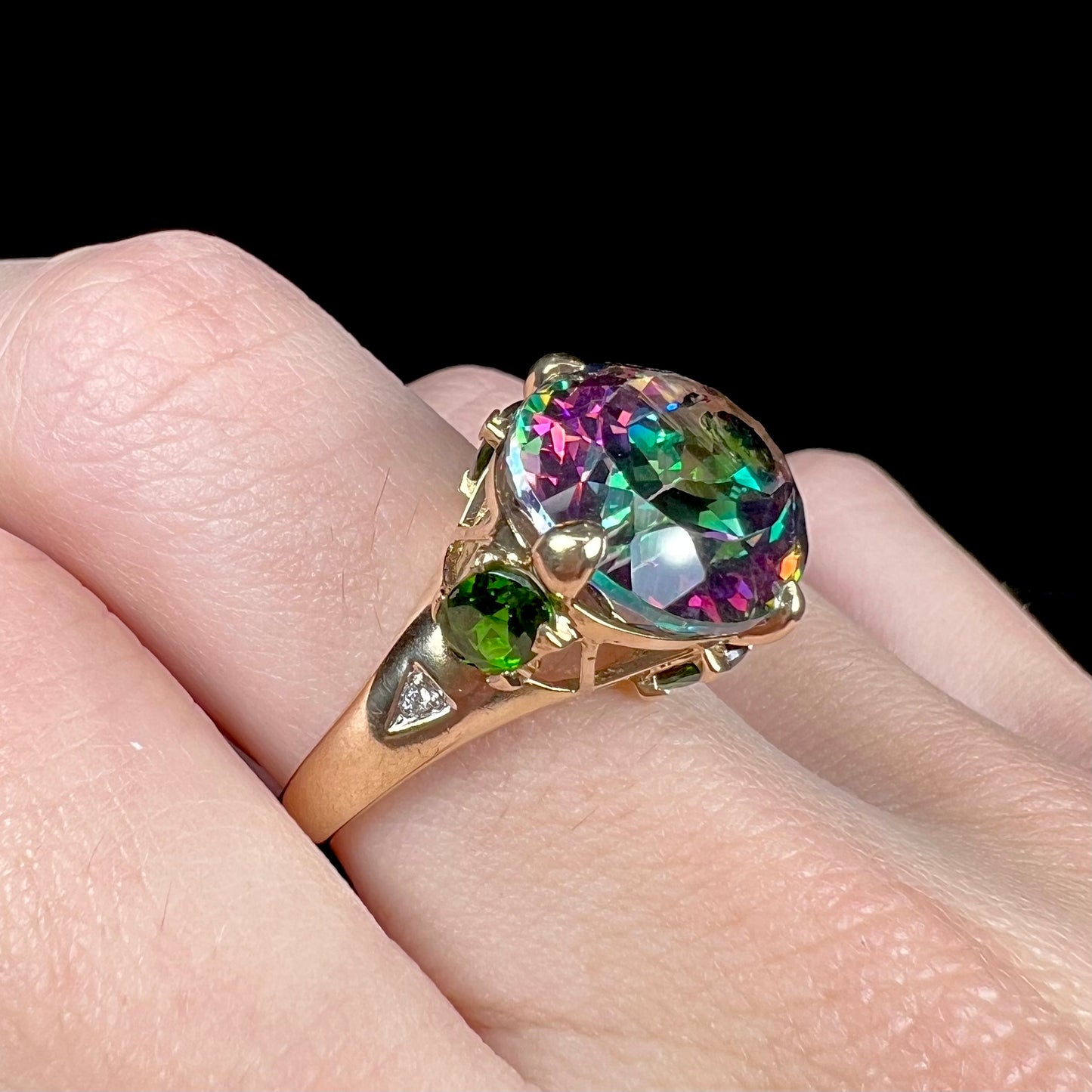 A ladies' large mystic topaz, chrome diopside, and diamond statement ring cast in 14k yellow gold.
