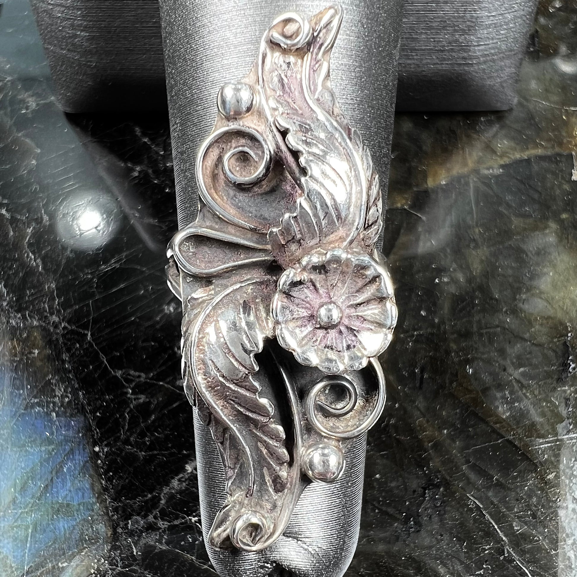 A sterling silver Navajo flower ring.