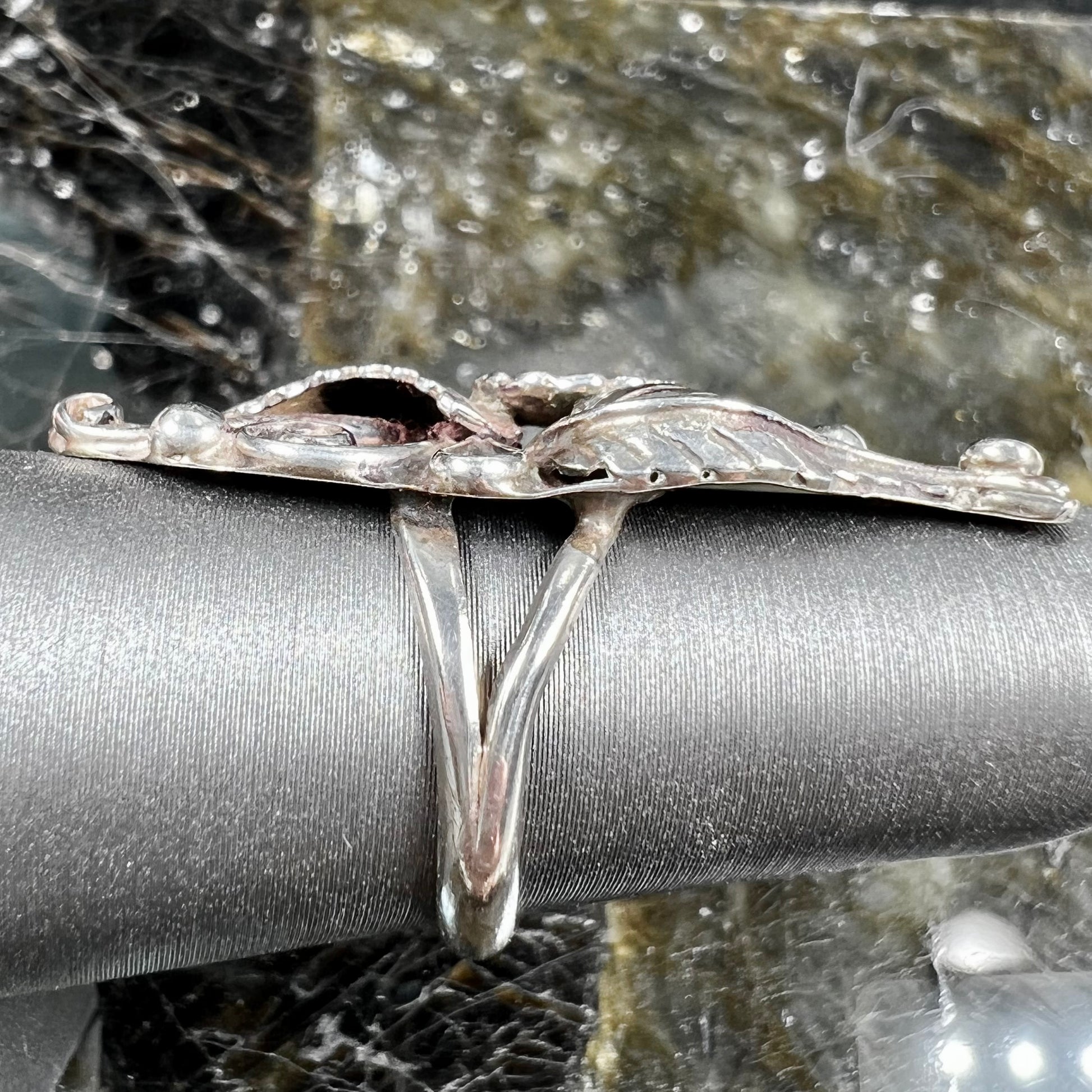 A sterling silver Navajo flower ring.