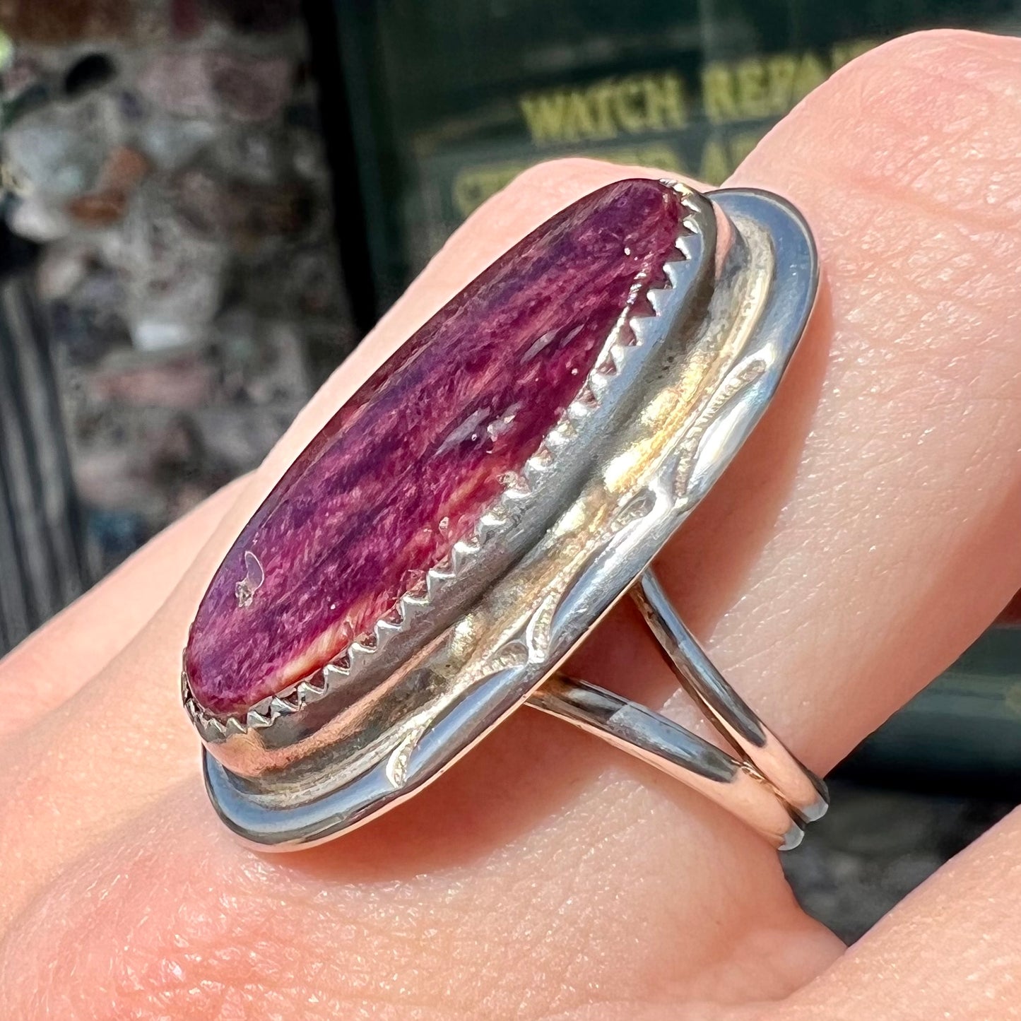 A sterling silver Navajo style ring set with a purple spiny oyster shell.