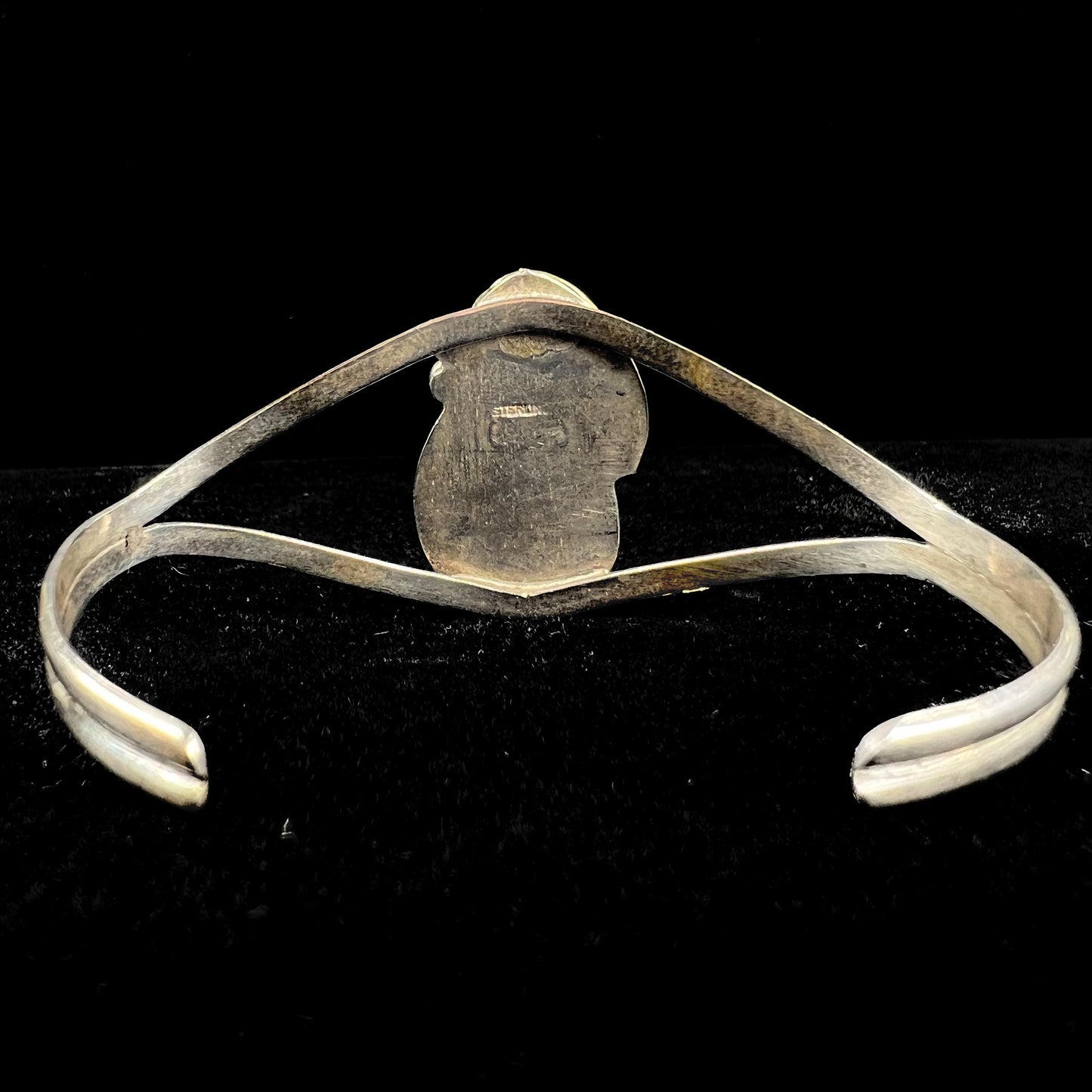 A ladies' silver Navajo cuff bracelet set with a piece of Morenci turquoise stone.