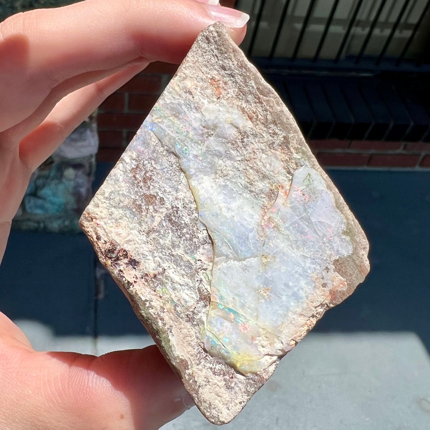 A lightly polished Painted Lady opal specimen from Andamooka, South Australia.