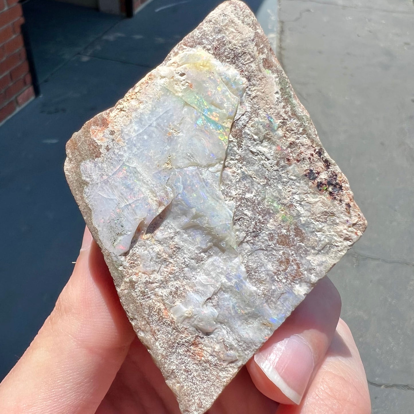 A lightly polished Painted Lady opal specimen from Andamooka, South Australia.