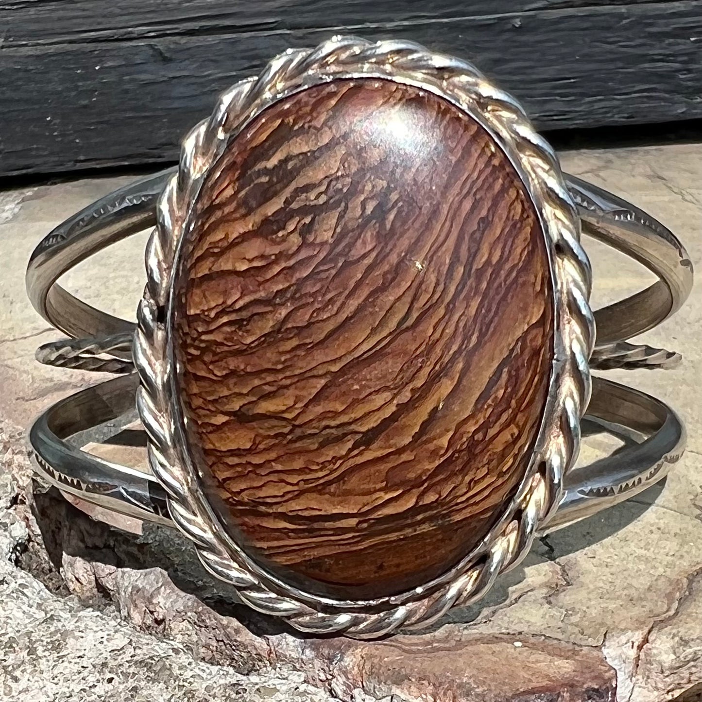 A sterling silver rope bezel set picture jasper cuff bracelet.