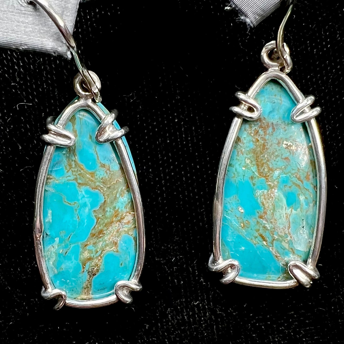 Sterling silver French wire earrings double prong set with cabochon cut turquoise from Pilot Mountain Mine.