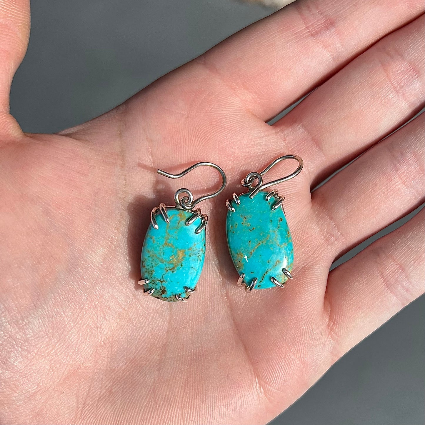 Sterling silver French wire earrings double prong set with cabochon cut Turquoise from Pilot Mountain Mine.