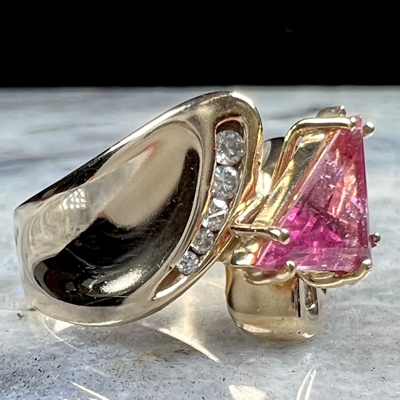 An estate yellow gold and diamond triangle cut Pala pink tourmaline ladies' ring.