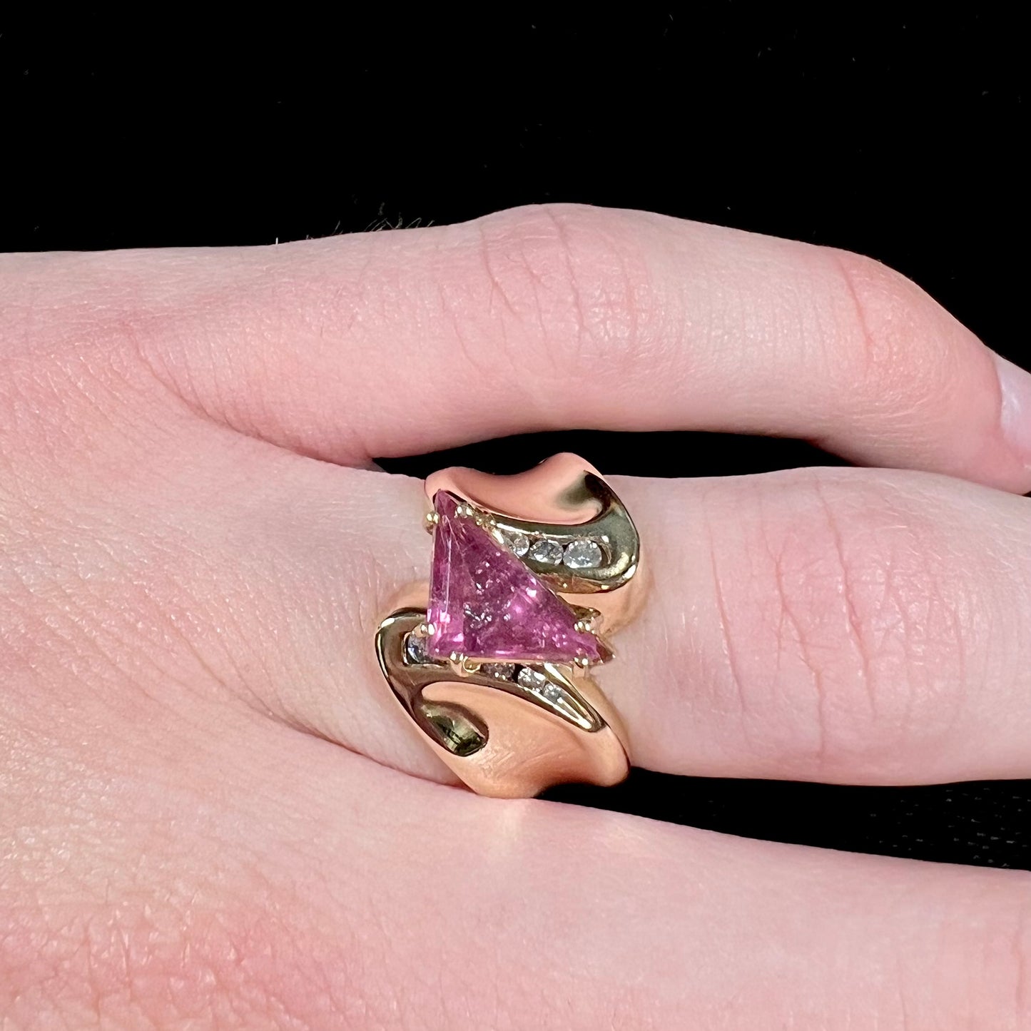 An estate yellow gold and diamond triangle cut Pala pink tourmaline ladies' ring.