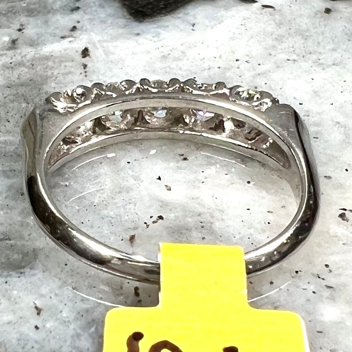 A vintage style ladies' platinum wedding band set with five round diamonds.