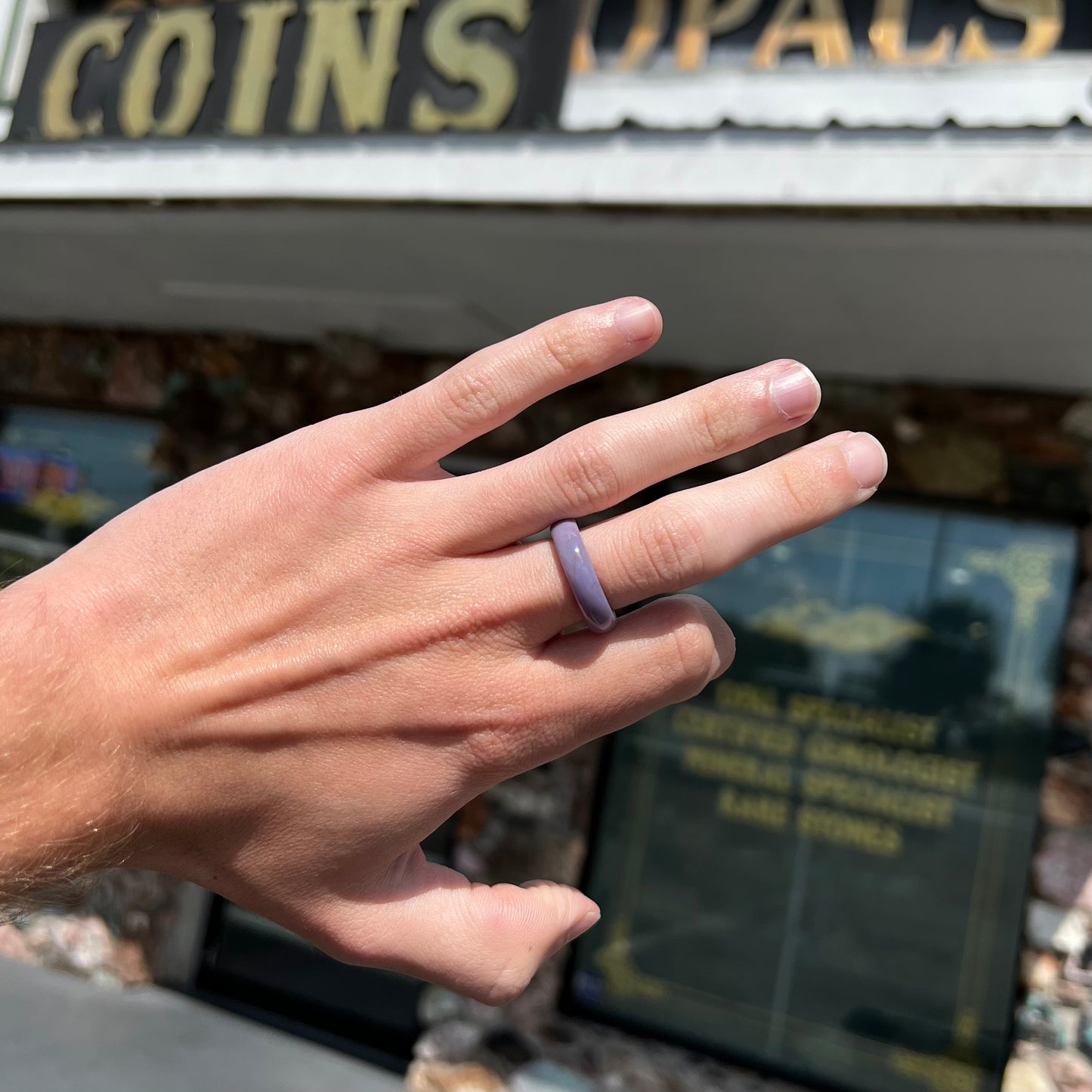 A carved lavender jade stone band.