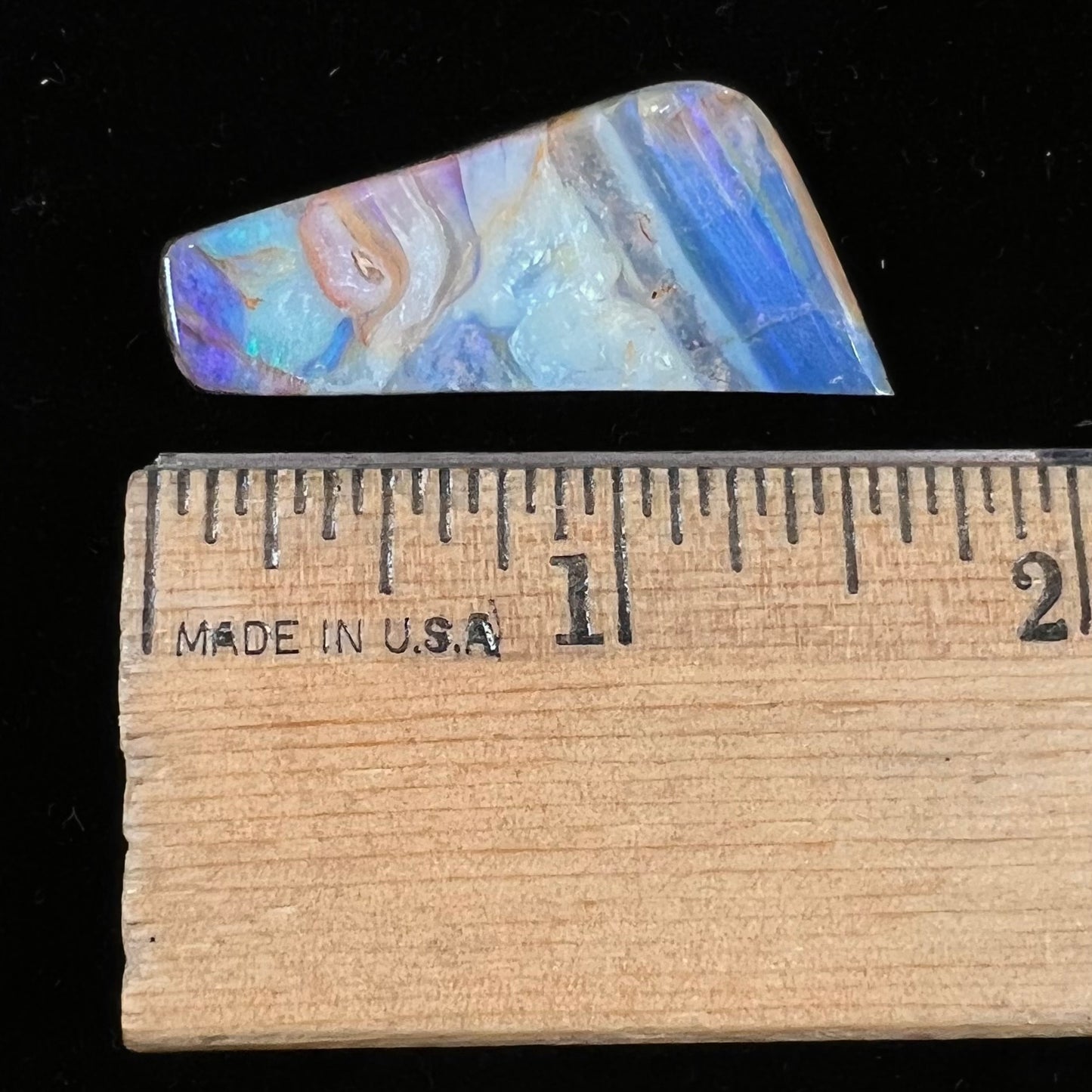 A loose, freeform cut, patterned Quilpie boulder opal stone from Queensland, Australia.